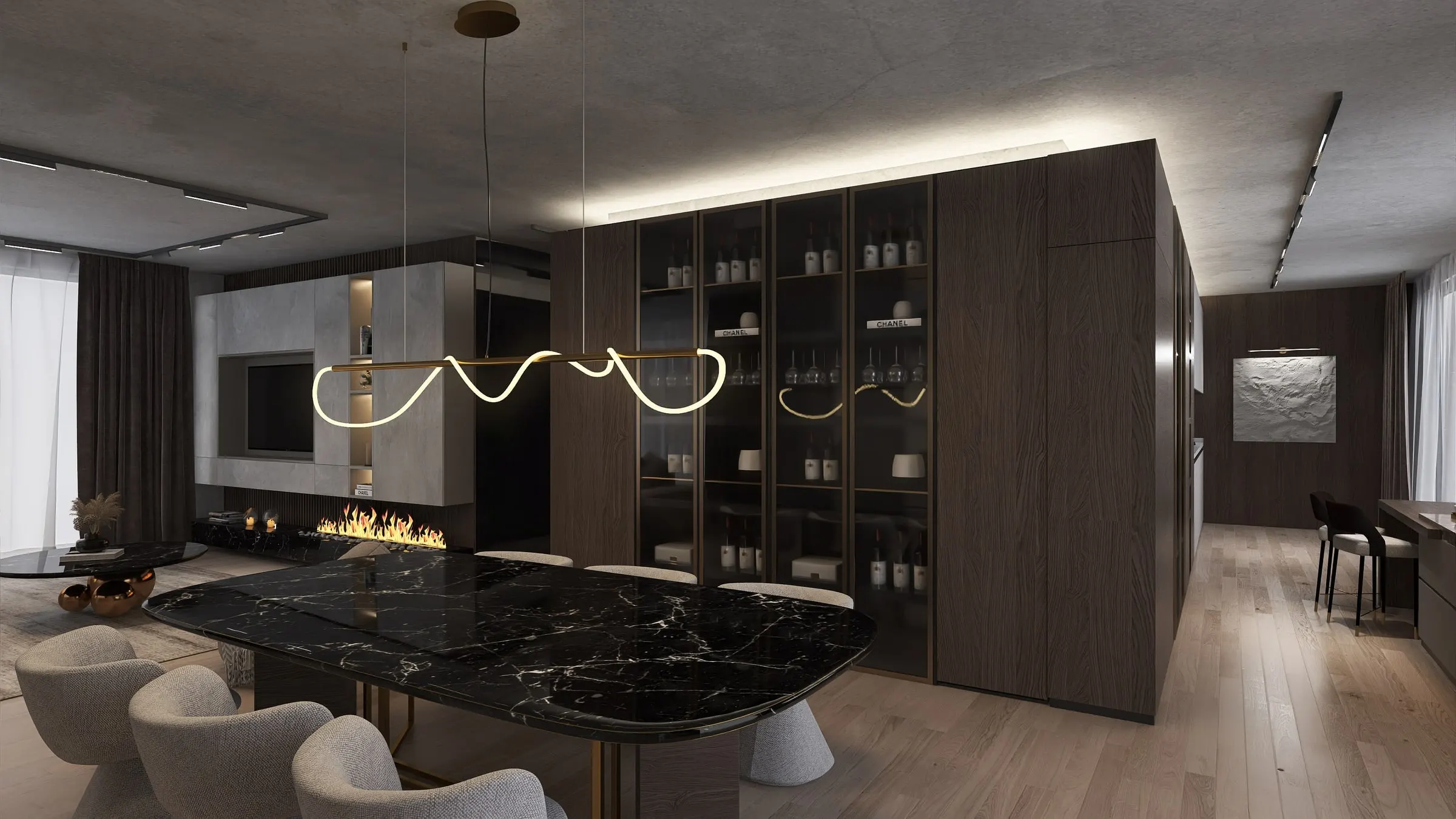 Dining area with marble table and sculptural light in front of cabinets and fireplace