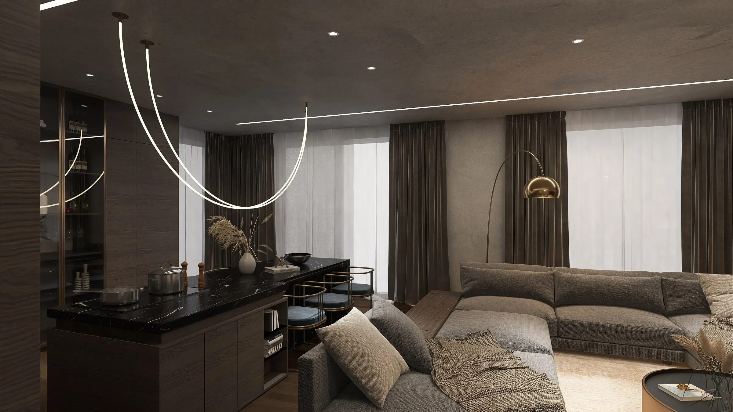 Open living area with corner sofa, black marble kitchen counter and curved light installation