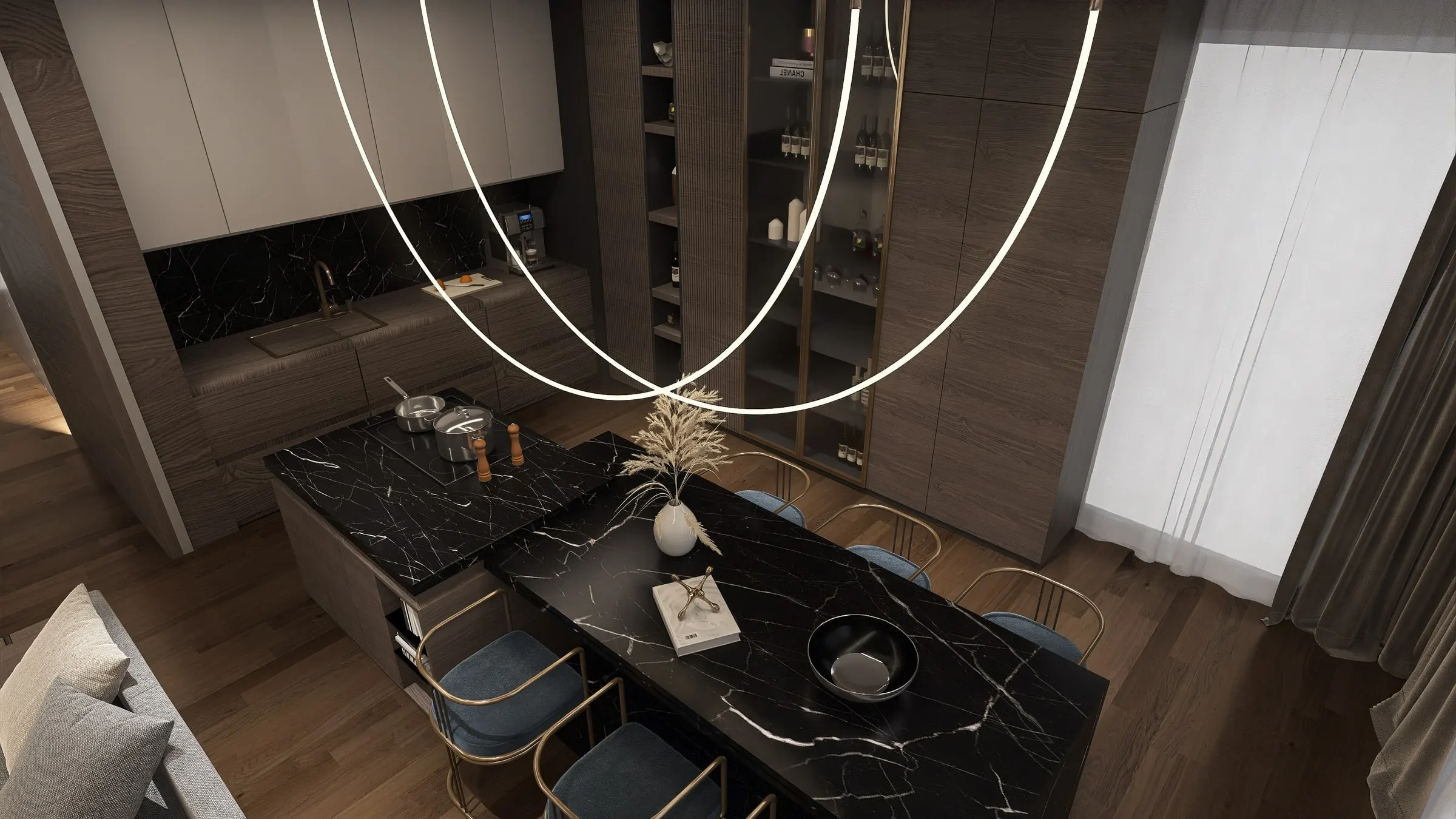 Black marble dining table under curved light strips in front of the kitchen