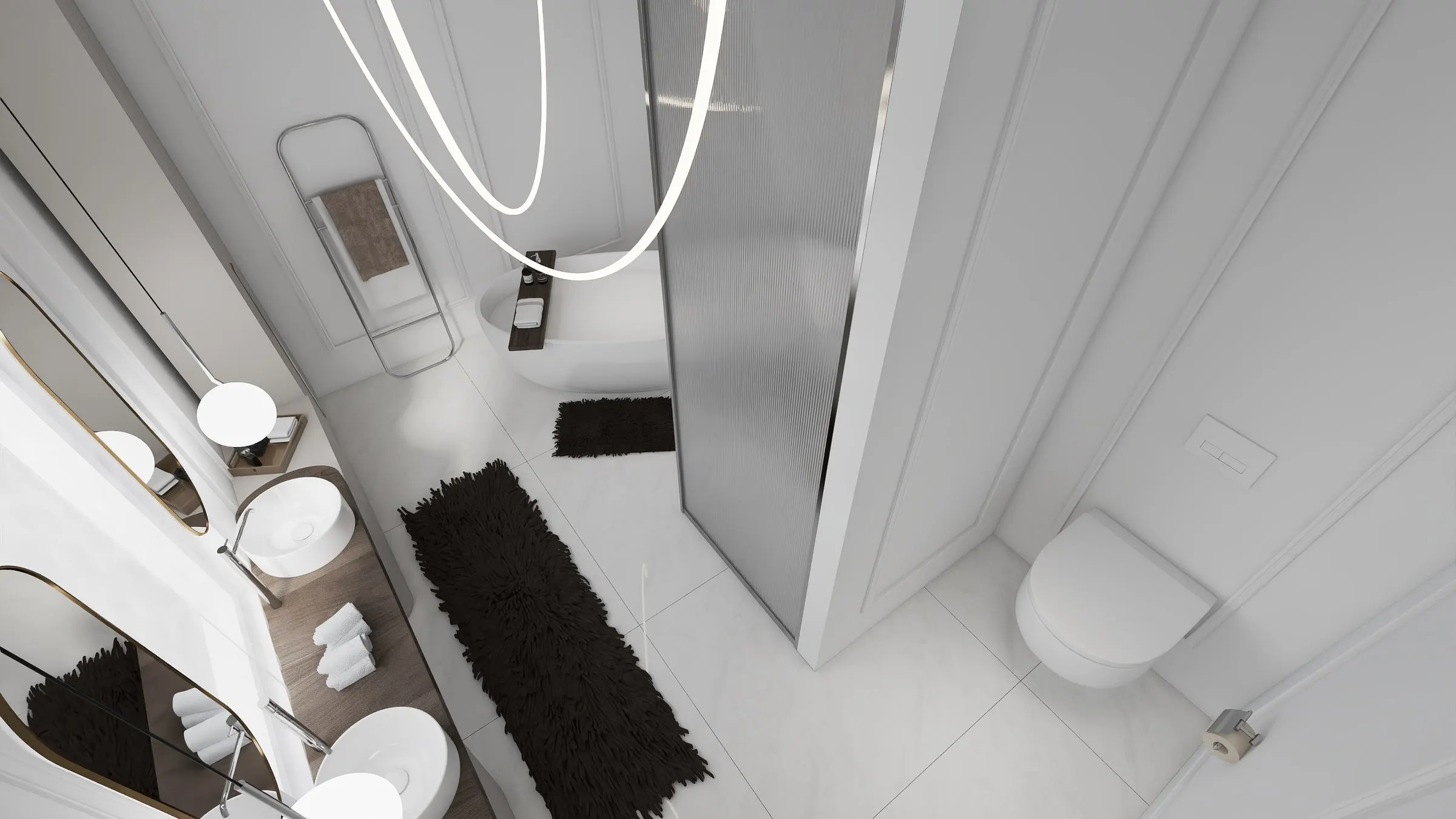 Bathroom from above with double vanity, glass partition and dark bath mats