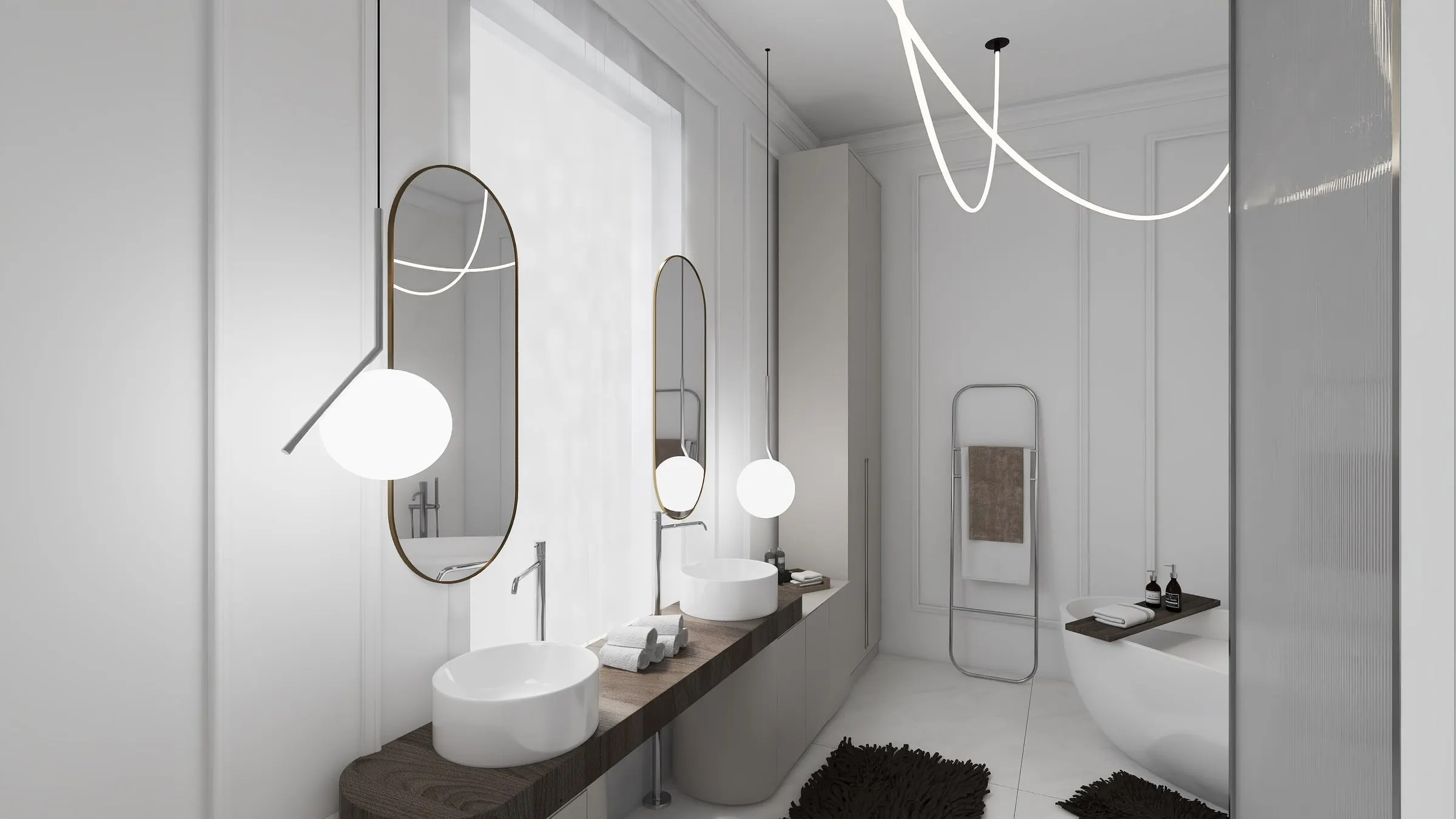 Bathroom with vessel basins on a wooden top, oval mirrors and freestanding tub